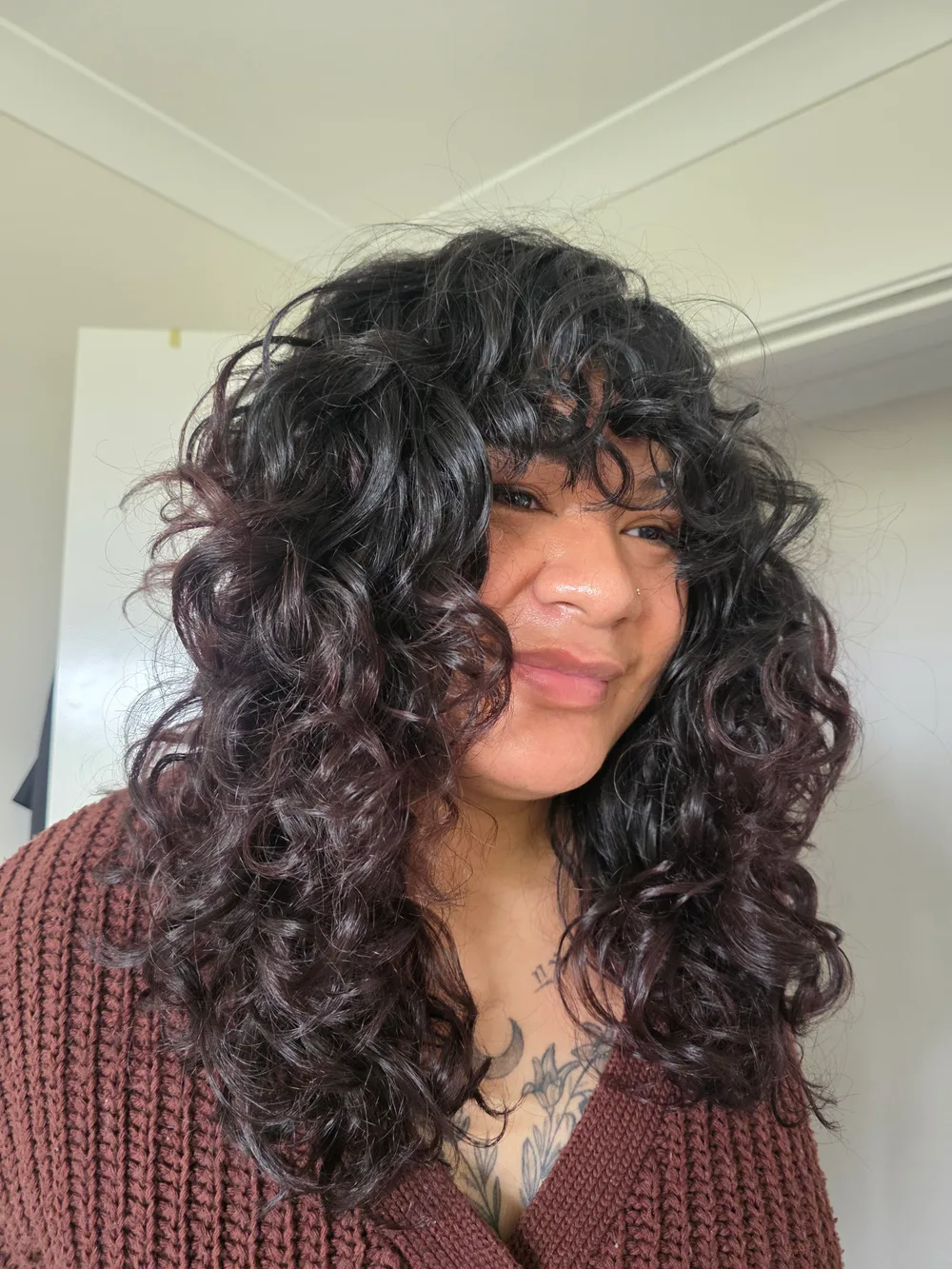 Long defined curls styled at Curl Identity